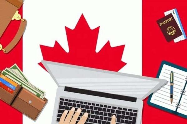 Chi phí xin visa Canada với hộ chiếu, tiền tệ và máy tính xách tay